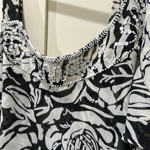 Lane Bryant top. sequin embellishment at top. Ruffles down the top. - Picture 2 of 3